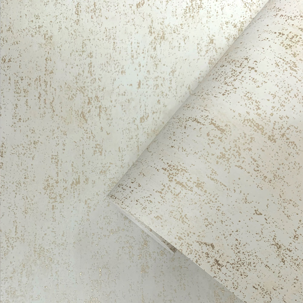 Indepth look at the raised metallic gold texture of the Mineral Plaster Wallpaper in Metallic Gold and Cream