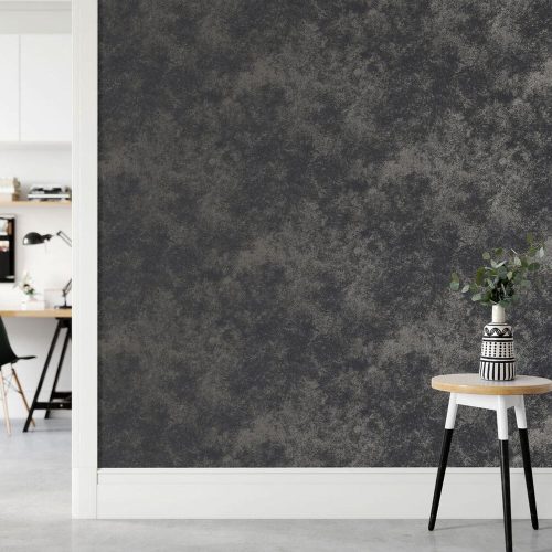 Office with Metallic Concrete Wallpaper installed on the wall. Features a side table with plant on the right and the left is a door opening on the left with desk in the next room