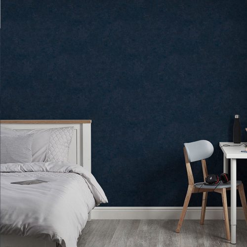 Bedroom with Textured Plaster Wallpaper Navy installed onto the wall. The room also has a large bed, modern desk and chair