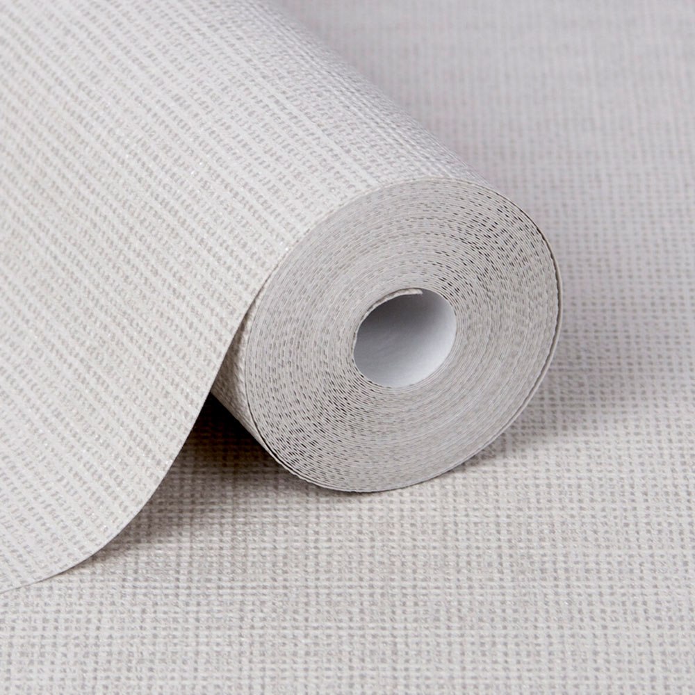Close up of the roll of beige fabric texture wallpaper, especially showing the thickness of Superfresco Easy wallpaper