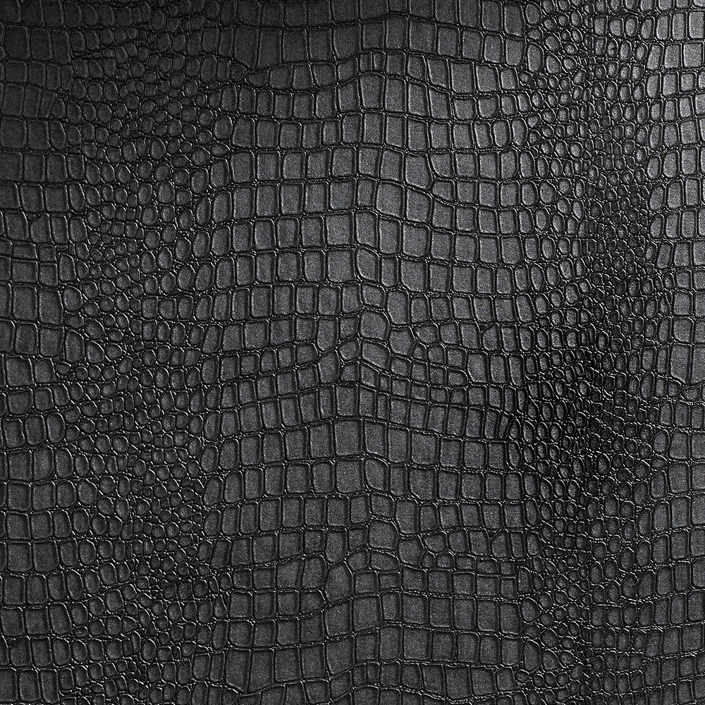 Close up shot of the matte black crocodile texture on the installed wallpaper