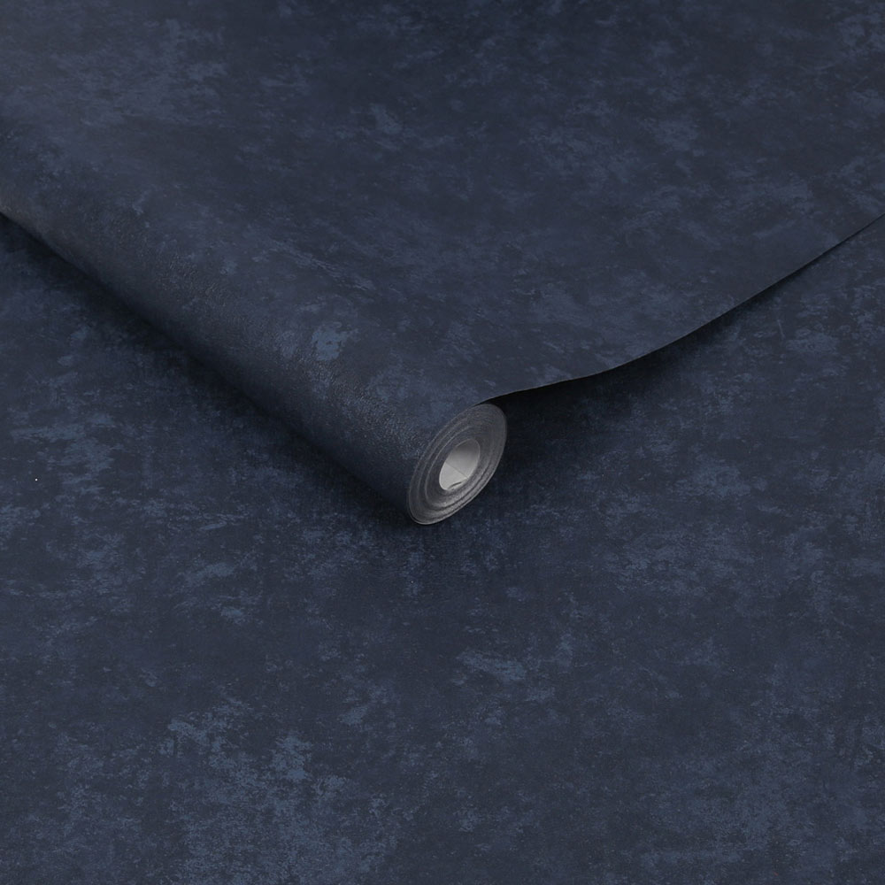 Roll of Faux Plaster Wallpaper Navy showing the mottled textured plaster look
