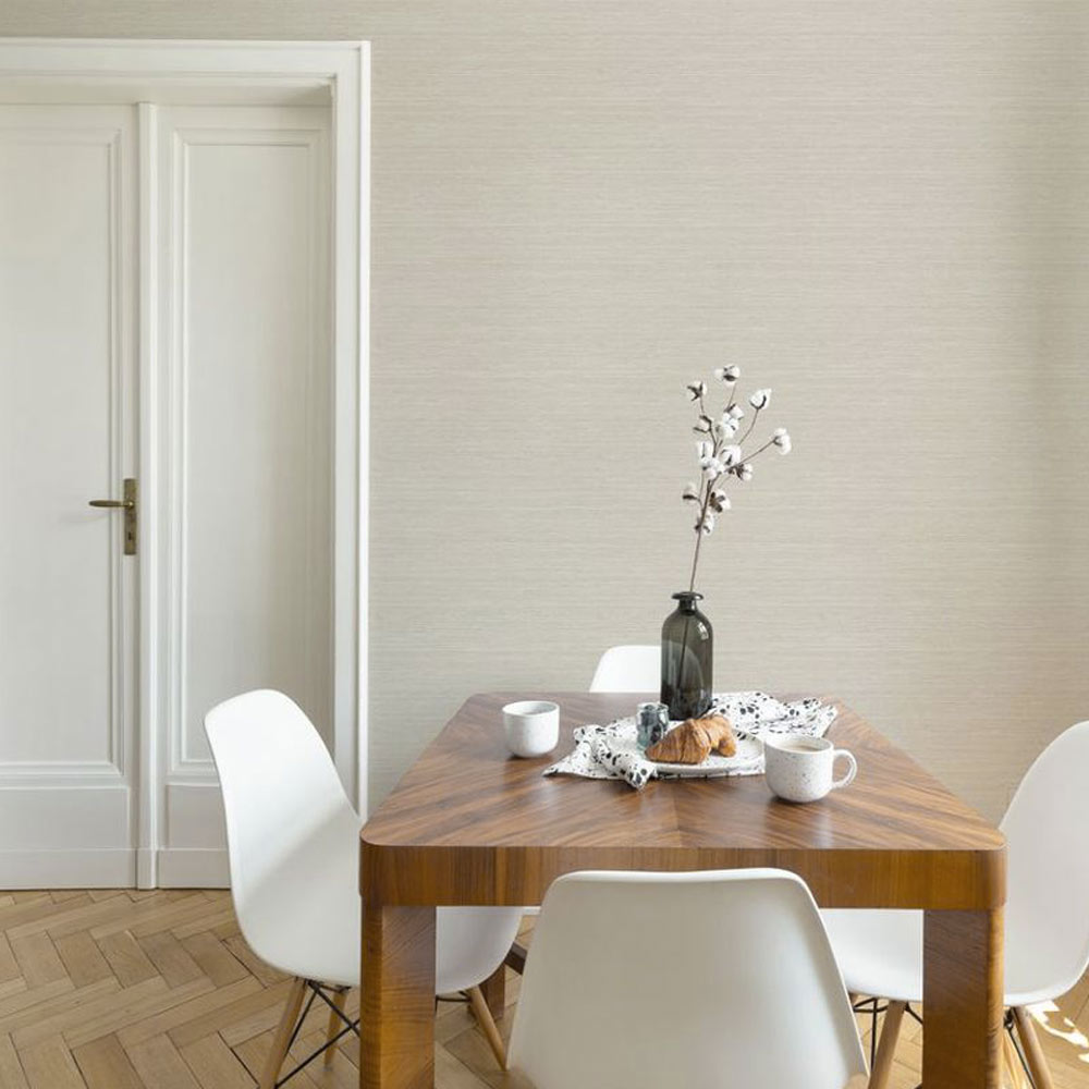 Dining Room with the metallic grasscloth wallpaper pearl installed on the walls. Also shown is a white internal door, wooden dining table (with vase and crockery) and 3 white bisto-style chairs