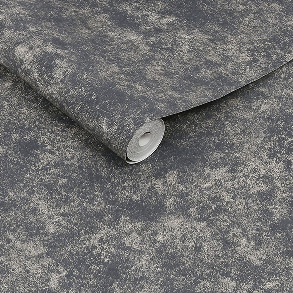 Roll of metallic textured plaster effect in mottled black, slightly unrolled