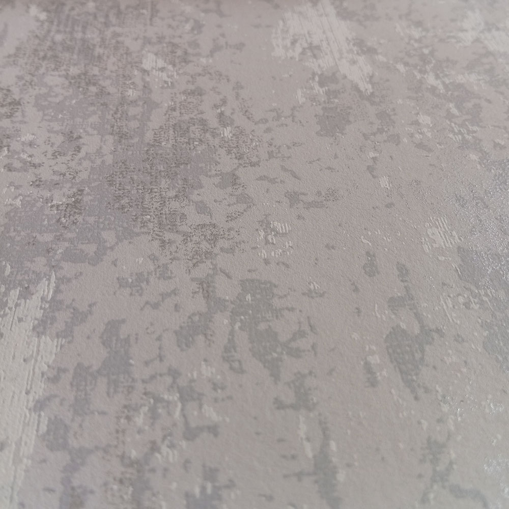 La Muur close-up photo of the printed chalk concrete wallpaper silver grey showing distressed effect
